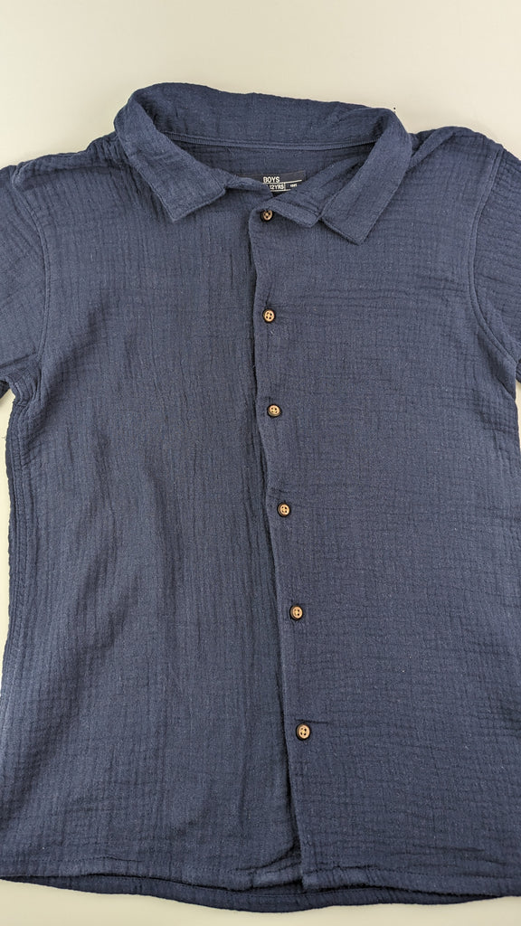 Navy Blue Muslin Shirt 12 Years Matalan Used, Preloved, Preworn & Second Hand Baby, Kids & Children's Clothing UK Online. Cheap affordable. Brands including Next, Joules, Nutmeg, TU, F&F, H&M.