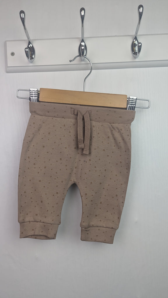 Disney George Beige Jogging Bottoms - Unisex Newborn George Used, Preloved, Preworn & Second Hand Baby, Kids & Children's Clothing UK Online. Cheap affordable. Brands including Next, Joules, Nutmeg Morrisons, TU, F&F, H&M.