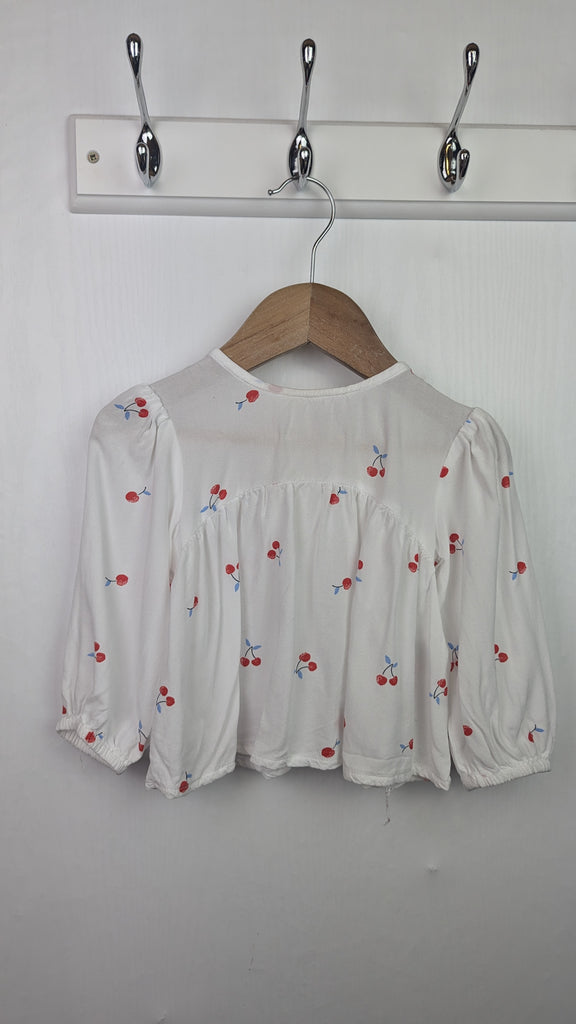 Primark White Cherries Top - Girls 12-18 Months Little Ones Preloved Used, Preloved, Preworn & Second Hand Baby, Kids & Children's Clothing UK Online. Cheap affordable. Brands including Next, Joules, Nutmeg Morrisons, TU, F&F, H&M.