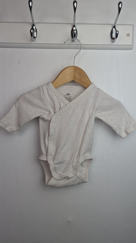 H&M Beige Wrap Bodysuit - Unisex 0-1 Months Little Ones Preloved Used, Preloved, Preworn & Second Hand Baby, Kids & Children's Clothing UK Online. Cheap affordable. Brands including Next, Joules, Nutmeg Morrisons, TU, F&F, H&M.