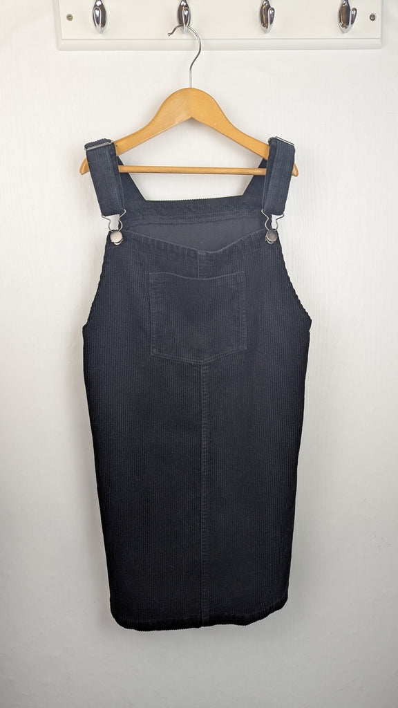 Nutmeg Black Cord Dungaree Dress - Girls 12-13 Years Little Ones Preloved Used, Preloved, Preworn & Second Hand Baby, Kids & Children's Clothing UK Online. Cheap affordable. Brands including Next, Joules, Nutmeg Morrisons, TU, F&F, H&M.