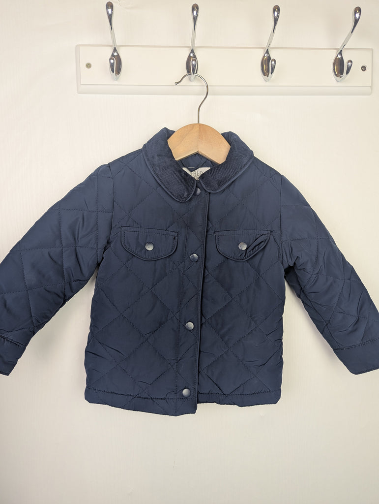 Fred & Flo Navy Quilted Jacket - Boys 12-18 Months Little Ones Preloved Used, Preloved, Preworn Baby, Girls & Boys Clothes. Kids & Children's second hand Clothing UK Online. Cheap affordable. Brands including Next, Joules, Nutmeg Morrisons, TU, F&F, H&M.