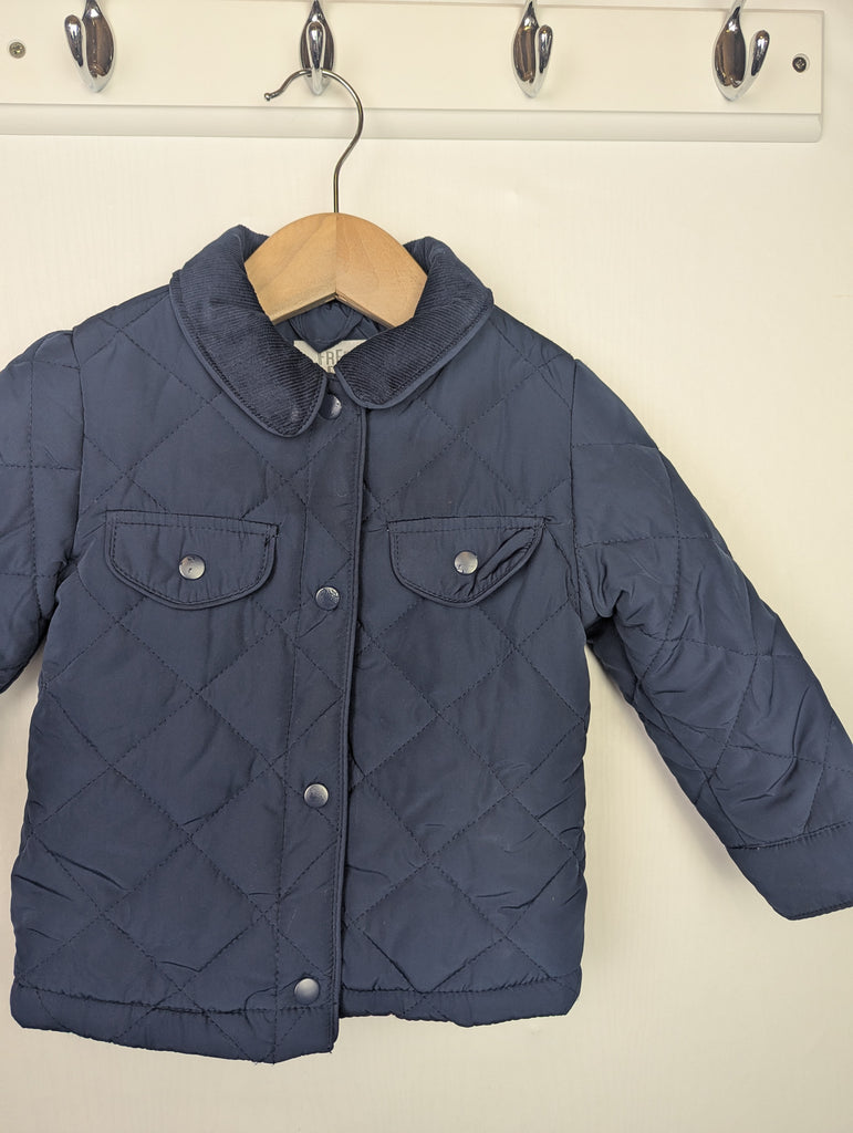 Fred & Flo Navy Quilted Jacket - Boys 12-18 Months Little Ones Preloved Used, Preloved, Preworn Baby, Girls & Boys Clothes. Kids & Children's second hand Clothing UK Online. Cheap affordable. Brands including Next, Joules, Nutmeg Morrisons, TU, F&F, H&M.