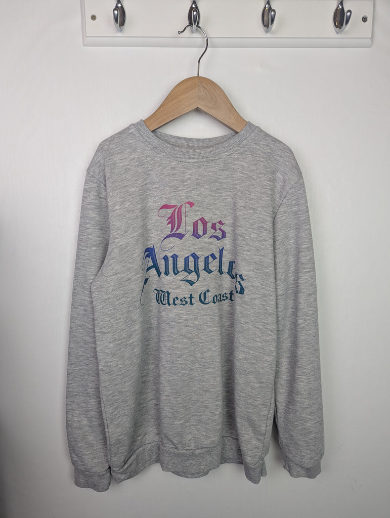 Primark Losa Angeles Jumper - Girls 9-10 Years Little Ones Preloved Used, Preloved, Preworn Baby, Girls & Boys Clothes. Kids & Children's second hand Clothing UK Online. Cheap affordable. Brands including Next, Joules, Nutmeg Morrisons, TU, F&F, H&M.