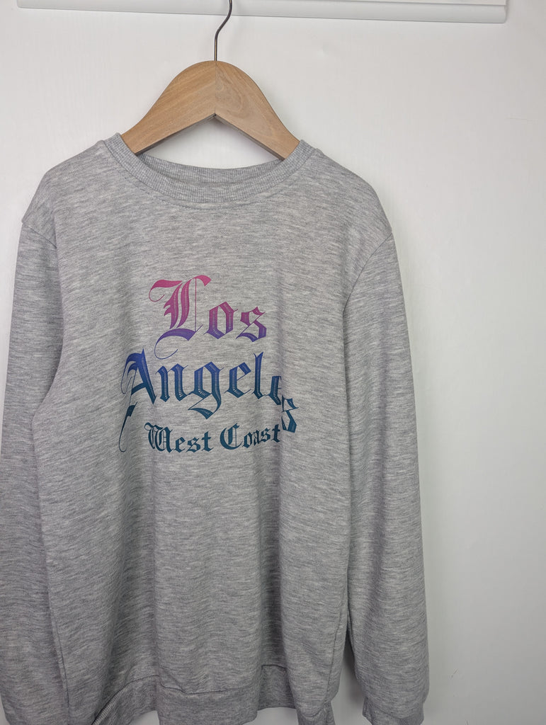 Primark Losa Angeles Jumper - Girls 9-10 Years Little Ones Preloved Used, Preloved, Preworn Baby, Girls & Boys Clothes. Kids & Children's second hand Clothing UK Online. Cheap affordable. Brands including Next, Joules, Nutmeg Morrisons, TU, F&F, H&M.