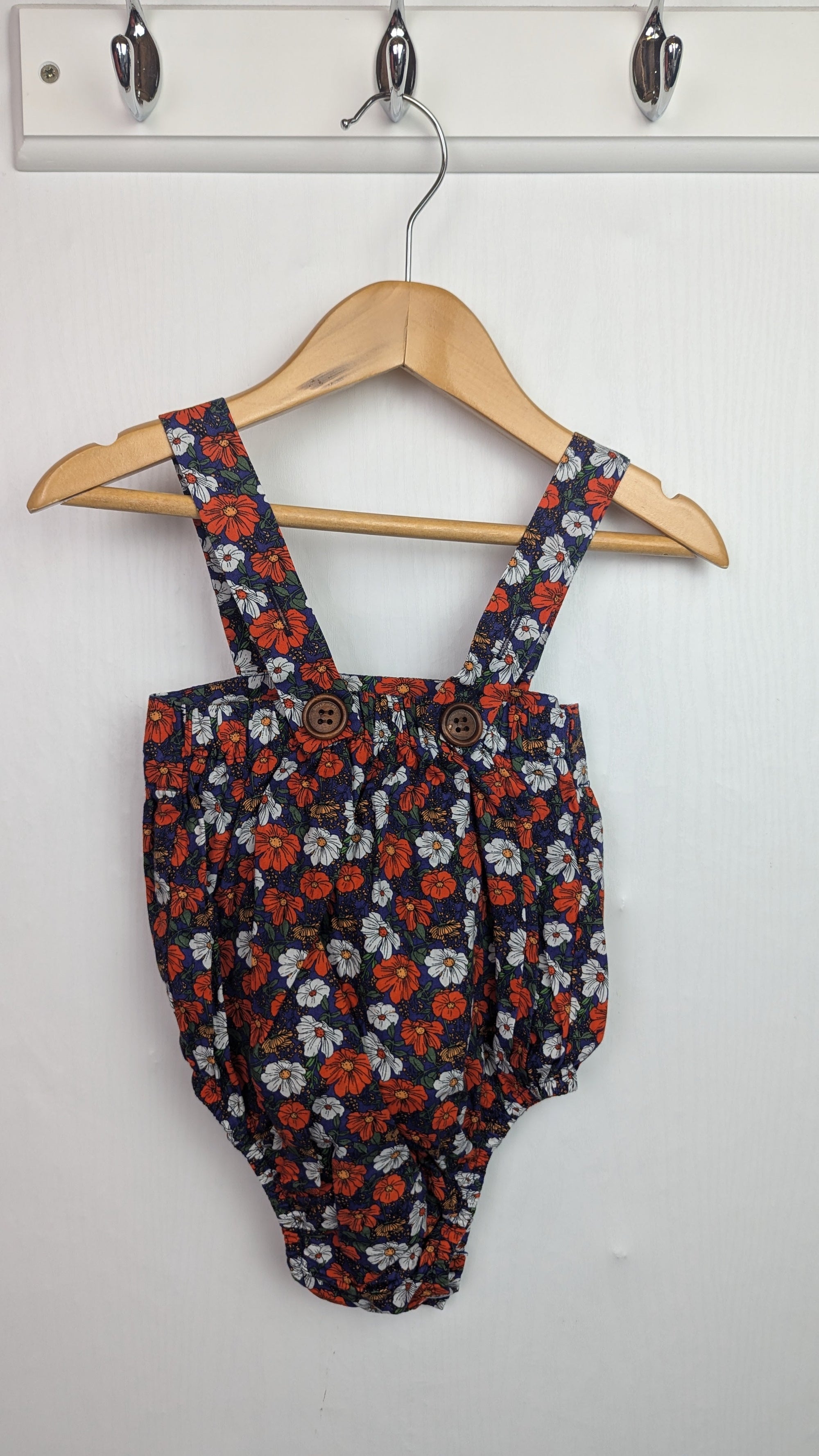 Dolly Wears Navy Floral Romper - Girls 12 - 18 Months - Little Ones Preloved. Second Hand Children's & Preloved Baby, Kids, Girls & Boys Clothes. UK online
