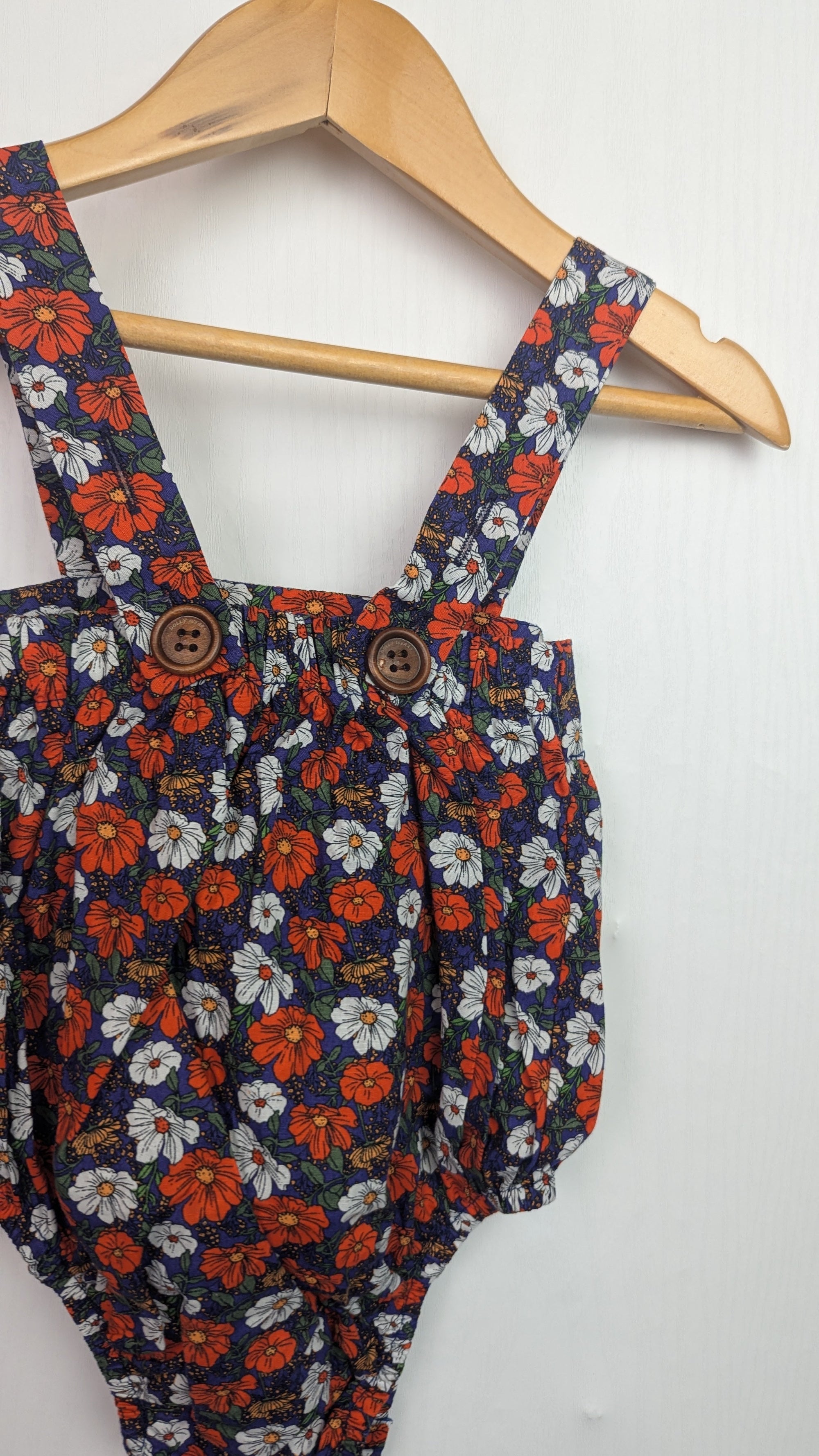 Dolly Wears Navy Floral Romper - Girls 12 - 18 Months - Little Ones Preloved. Second Hand Children's & Preloved Baby, Kids, Girls & Boys Clothes. UK online