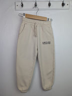F&F Cream 'Limitless' Joggers - Boys 4 - 5 Years - Little Ones Preloved. Second Hand Children's & Preloved Baby, Kids, Girls & Boys Clothes. UK online