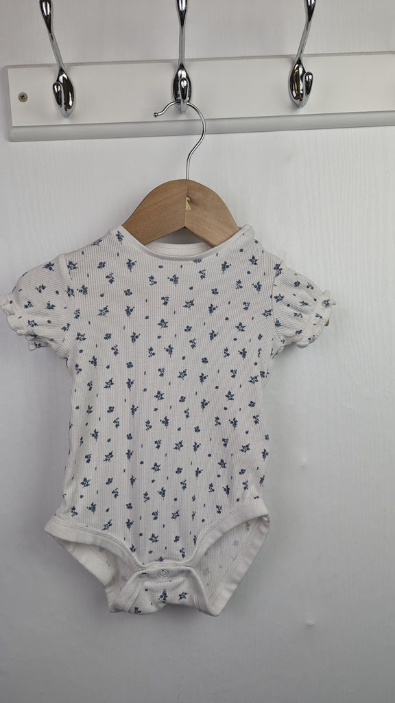 F&F Ribbed Floral Bodysuit - Girls 3-6 Months Little Ones Preloved Used, Preloved, Preworn & Second Hand Baby, Kids & Children's Clothing UK Online. Cheap affordable. Brands including Next, Joules, Nutmeg Morrisons, TU, F&F, H&M.