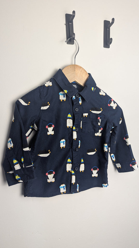 Fred & Flo Navy Penguin Long Sleeve Shirt - Boys 6-9 Months Little Ones Preloved Used, Preloved, Preworn Baby, Girls & Boys Clothes. Kids & Children's second hand Clothing UK Online. Cheap affordable. Brands including Next, Joules, Nutmeg Morrisons, TU, F&F, H&M.