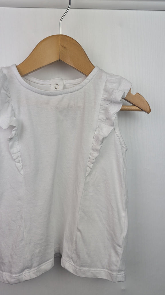 Fred & Flo White Sleeveless Top - Girls 9-12 Months Fred & Flo Used, Preloved, Preworn Baby, Girls & Boys Clothes. Kids & Children's second hand Clothing UK Online. Cheap affordable. Brands including Next, Joules, Nutmeg Morrisons, TU, F&F, H&M.