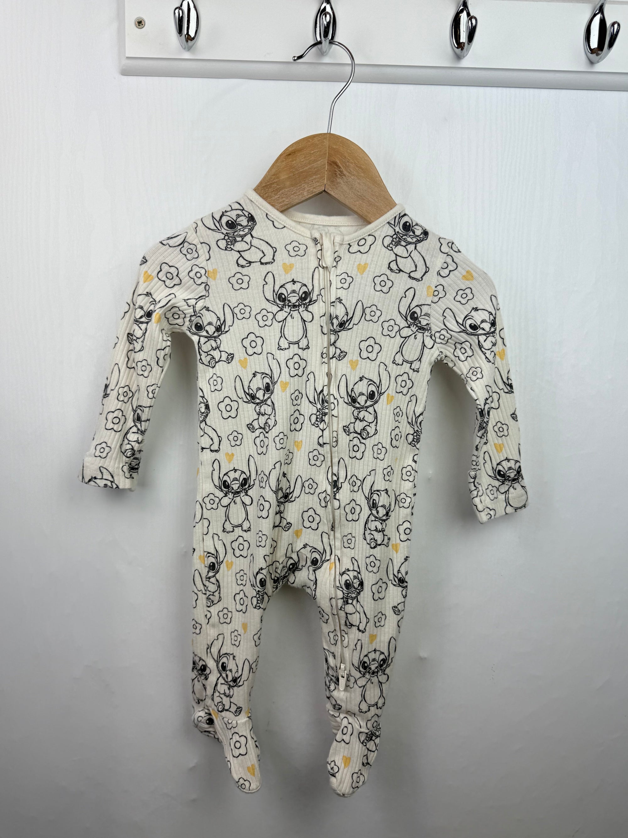 George Disney Stitch Zip Sleepsuit - Girls 0 - 3 Months - Little Ones Preloved. Second Hand Children's & Preloved Baby, Kids, Girls & Boys Clothes. UK online