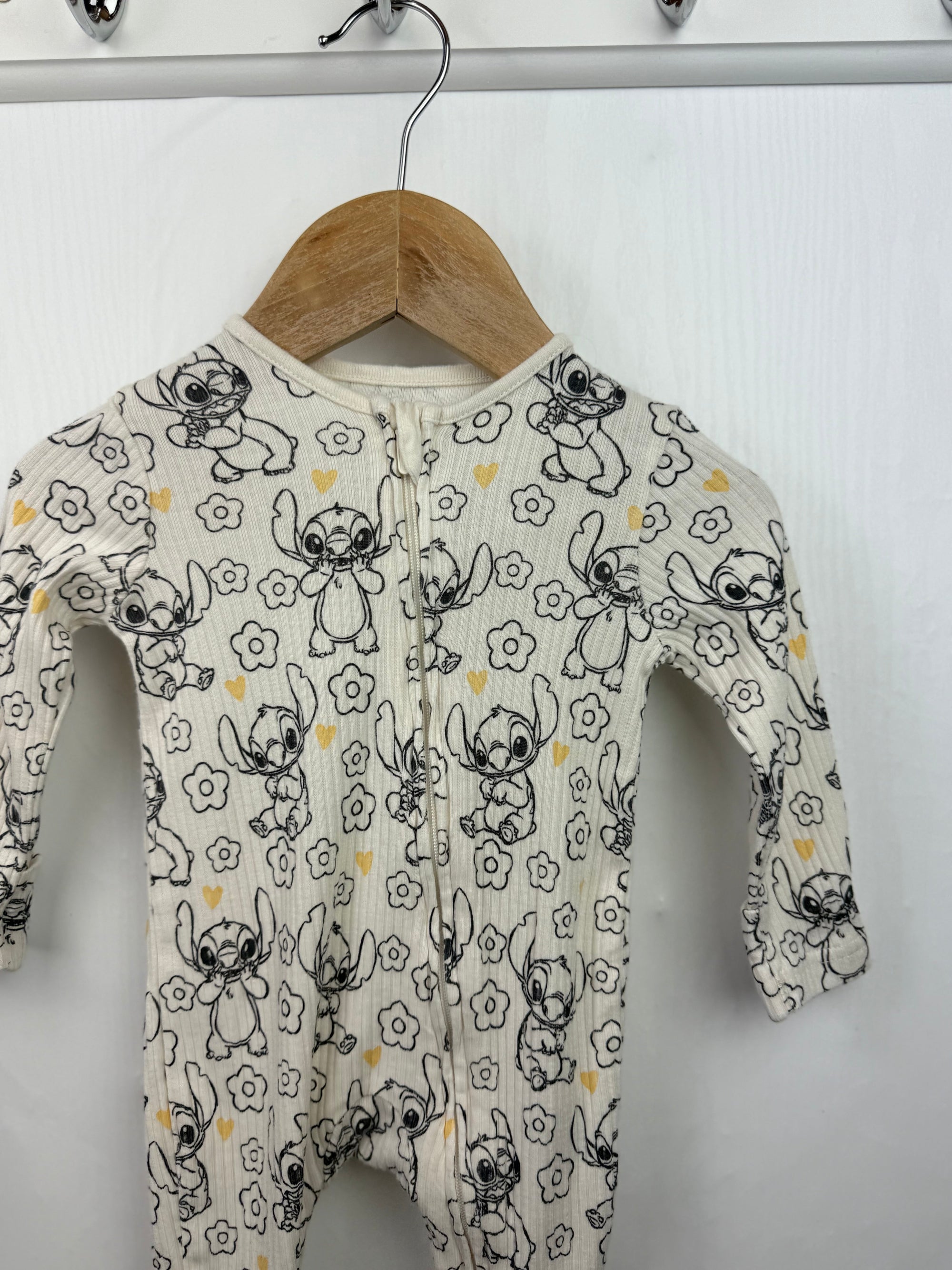 George Disney Stitch Zip Sleepsuit - Girls 0 - 3 Months - Little Ones Preloved. Second Hand Children's & Preloved Baby, Kids, Girls & Boys Clothes. UK online