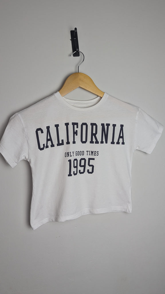 George White California Cropped Top - Girls 8-9 Years Little Ones Preloved Used, Preloved, Preworn Baby, Girls & Boys Clothes. Kids & Children's second hand Clothing UK Online. Cheap affordable. Brands including Next, Joules, Nutmeg Morrisons, TU, F&F, H&M.