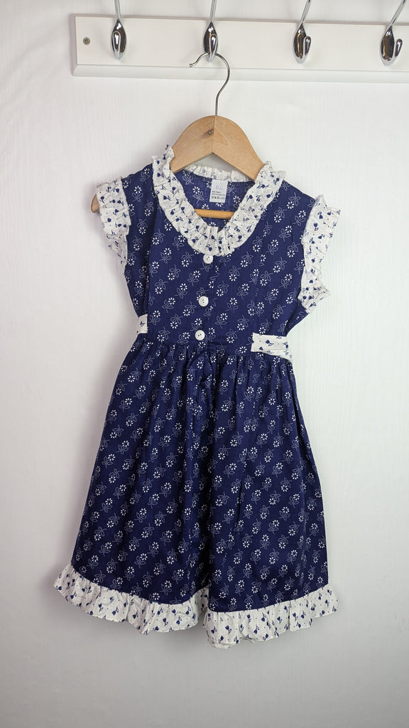 Handmade Blue & White Floral Dress - Girls 6-7 Years Little Ones Preloved Used, Preloved, Preworn Baby, Girls & Boys Clothes. Kids & Children's second hand Clothing UK Online. Cheap affordable. Brands including Next, Joules, Nutmeg Morrisons, TU, F&F, H&M.