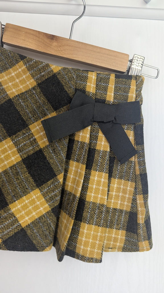 Matalan Mustard Tartan Bow Skirt - Girls 12-18 Months Matalan Used, Preloved, Preworn & Second Hand Baby, Kids & Children's Clothing UK Online. Cheap affordable. Brands including Next, Joules, Nutmeg Morrisons, TU, F&F, H&M.