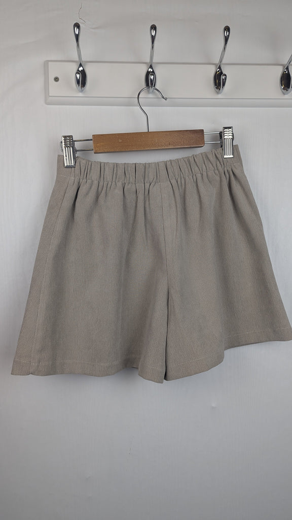 Mayoral Beige Cord Button Skort - Girls 9 Years Little Ones Preloved Used, Preloved, Preworn Baby, Girls & Boys Clothes. Kids & Children's second hand Clothing UK Online. Cheap affordable. Brands including Next, Joules, Nutmeg Morrisons, TU, F&F, H&M.