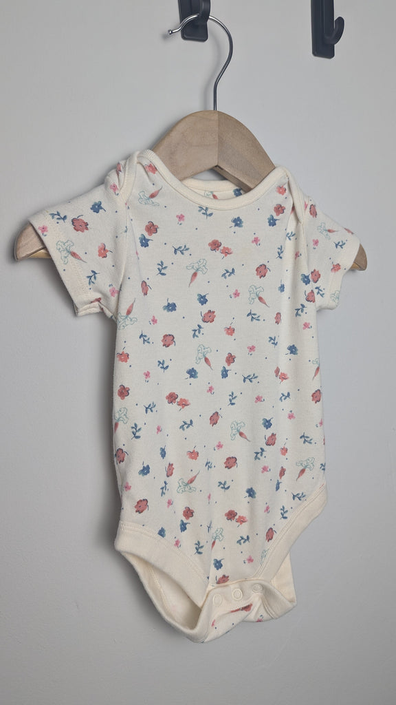 M&S Cream Floral Bodysuit - Girls 6-9 Months Little Ones Preloved Used, Preloved, Preworn & Second Hand Baby, Kids & Children's Clothing UK Online. Cheap affordable. Brands including Next, Joules, Nutmeg Morrisons, TU, F&F, H&M.