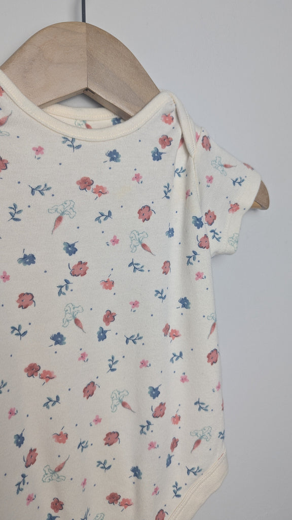 M&S Cream Floral Bodysuit - Girls 6-9 Months Little Ones Preloved Used, Preloved, Preworn & Second Hand Baby, Kids & Children's Clothing UK Online. Cheap affordable. Brands including Next, Joules, Nutmeg Morrisons, TU, F&F, H&M.