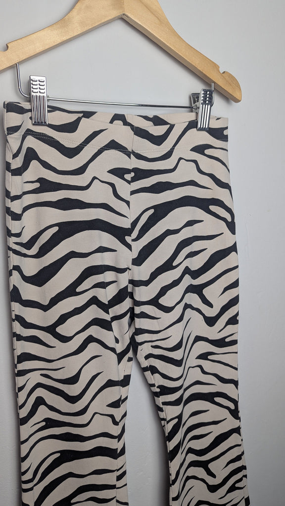 M&S Cream Zebra Print Flared Leggings - Girls 11-12 Years Little Ones Preloved Used, Preloved, Preworn Baby, Girls & Boys Clothes. Kids & Children's second hand Clothing UK Online. Cheap affordable. Brands including Next, Joules, Nutmeg Morrisons, TU, F&F, H&M.