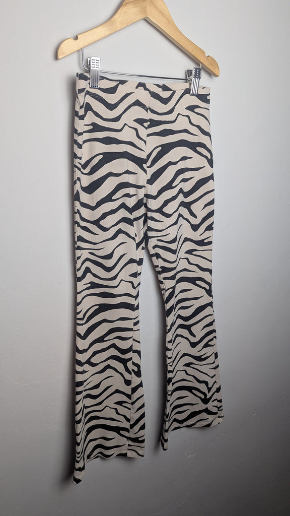 M&S Cream Zebra Print Flared Leggings - Girls 11-12 Years Little Ones Preloved Used, Preloved, Preworn Baby, Girls & Boys Clothes. Kids & Children's second hand Clothing UK Online. Cheap affordable. Brands including Next, Joules, Nutmeg Morrisons, TU, F&F, H&M.