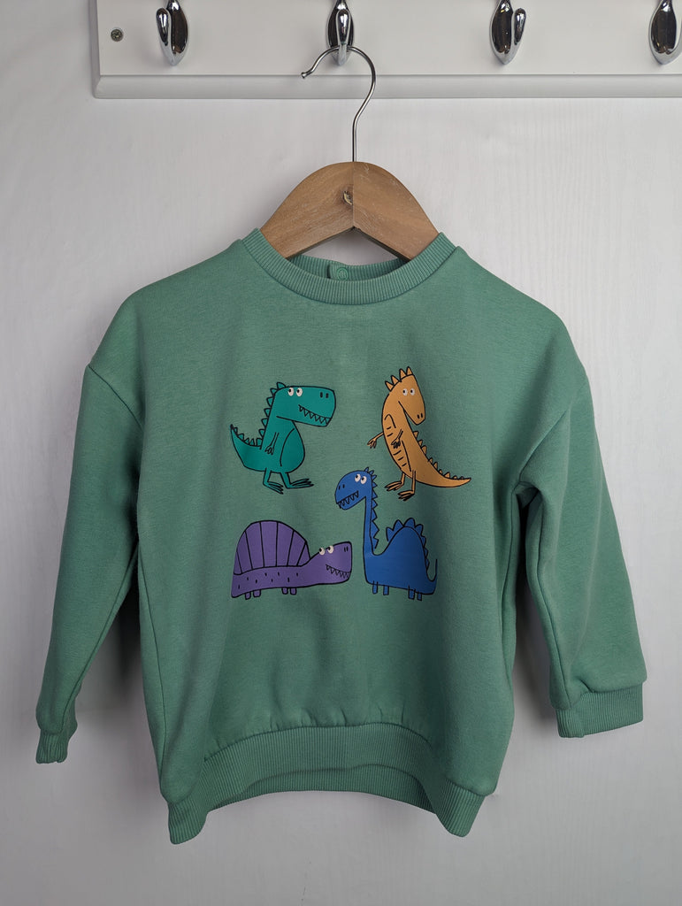 M&S Green Dinosaur Jumper - Boys 18-24 Months Little Ones Preloved Used, Preloved, Preworn Baby, Girls & Boys Clothes. Kids & Children's second hand Clothing UK Online. Cheap affordable. Brands including Next, Joules, Nutmeg Morrisons, TU, F&F, H&M.