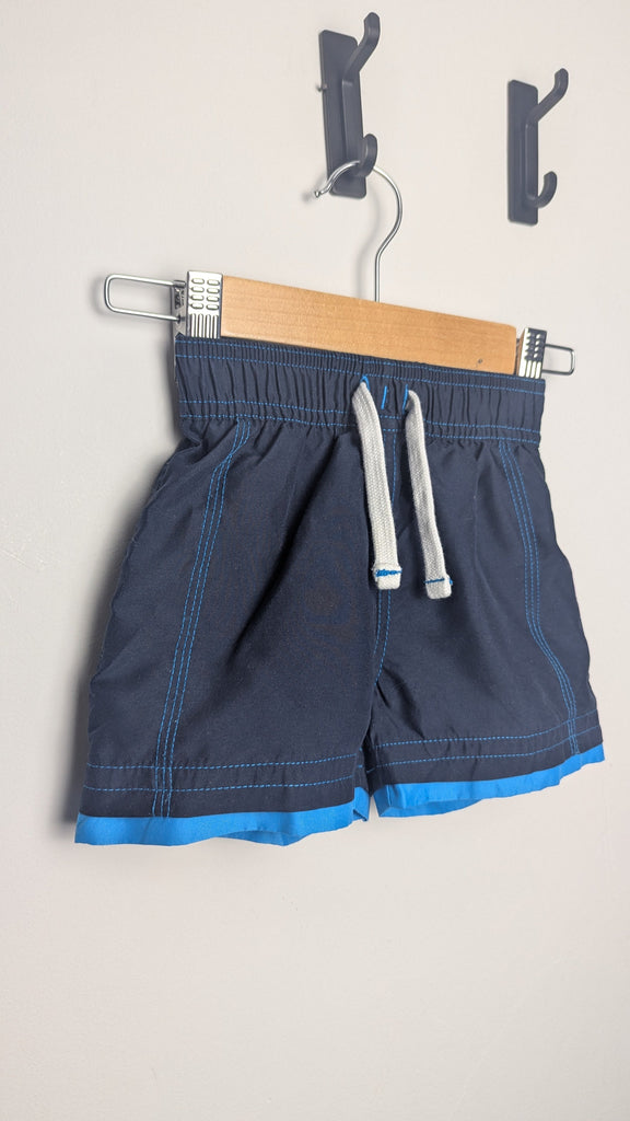 M&S Navy Swim Shorts - Boyd 12-18 Months Little Ones Preloved Used, Preloved, Preworn & Second Hand Baby, Kids & Children's Clothing UK Online. Cheap affordable. Brands including Next, Joules, Nutmeg Morrisons, TU, F&F, H&M.