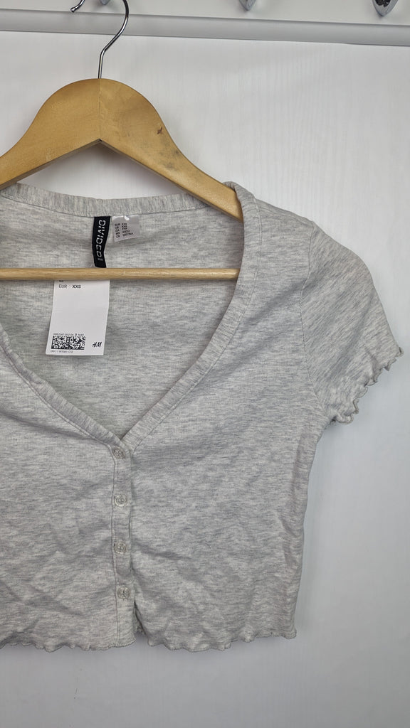 NEW H&M Grey Ladies Crop Top - Size XXS H&M Used, Preloved, Preworn Baby, Girls & Boys Clothes. Kids & Children's second hand Clothing UK Online. Cheap affordable. Brands including Next, Joules, Nutmeg Morrisons, TU, F&F, H&M.