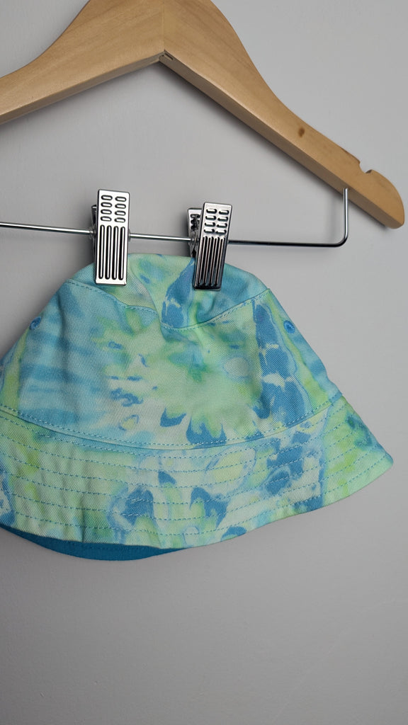 NEW M&S Blue/Green Tie Dye Bucket Hat - Unisex 12-18 Months Little Ones Preloved Used, Preloved, Preworn Baby, Girls & Boys Clothes. Kids & Children's second hand Clothing UK Online. Cheap affordable. Brands including Next, Joules, Nutmeg Morrisons, TU, F&F, H&M.