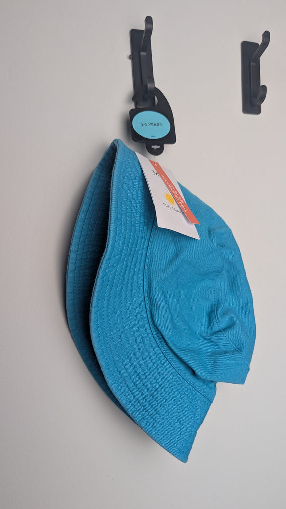 NEW M&S Plain Blue Bucket Hat - Unisex 12-18 Months Little Ones Preloved Used, Preloved, Preworn Baby, Girls & Boys Clothes. Kids & Children's second hand Clothing UK Online. Cheap affordable. Brands including Next, Joules, Nutmeg Morrisons, TU, F&F, H&M.