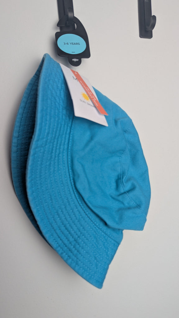 NEW M&S Plain Blue Bucket Hat - Unisex 12-18 Months Little Ones Preloved Used, Preloved, Preworn Baby, Girls & Boys Clothes. Kids & Children's second hand Clothing UK Online. Cheap affordable. Brands including Next, Joules, Nutmeg Morrisons, TU, F&F, H&M.