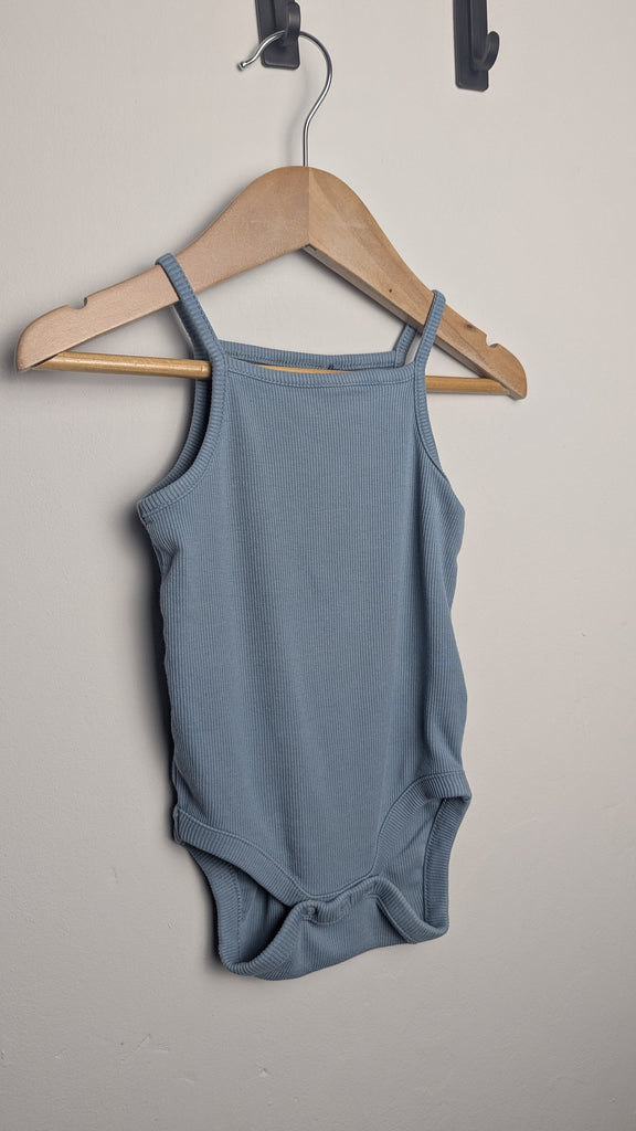 Next Blue Ribbed Strap Bodysuit - Unisex 6-9 Months Little Ones Preloved Used, Preloved, Preworn & Second Hand Baby, Kids & Children's Clothing UK Online. Cheap affordable. Brands including Next, Joules, Nutmeg Morrisons, TU, F&F, H&M.