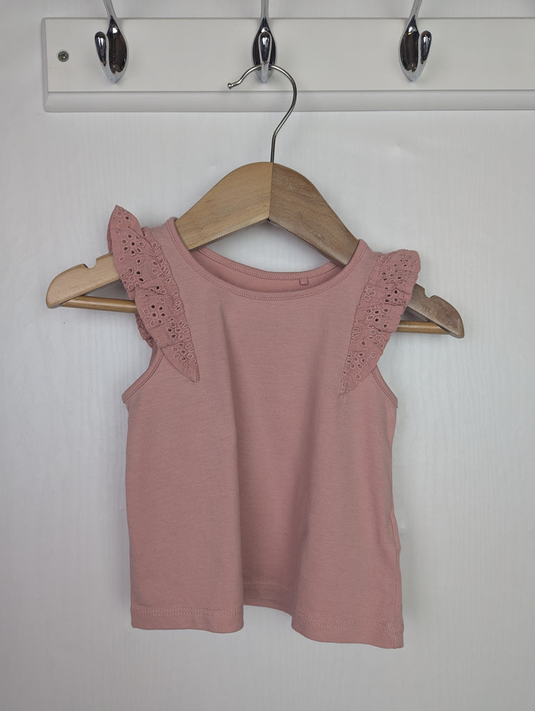 Next Eyelet Vest Top - Girls 6-9 Months Little Ones Preloved Used, Preloved, Preworn Baby, Girls & Boys Clothes. Kids & Children's second hand Clothing UK Online. Cheap affordable. Brands including Next, Joules, Nutmeg Morrisons, TU, F&F, H&M.