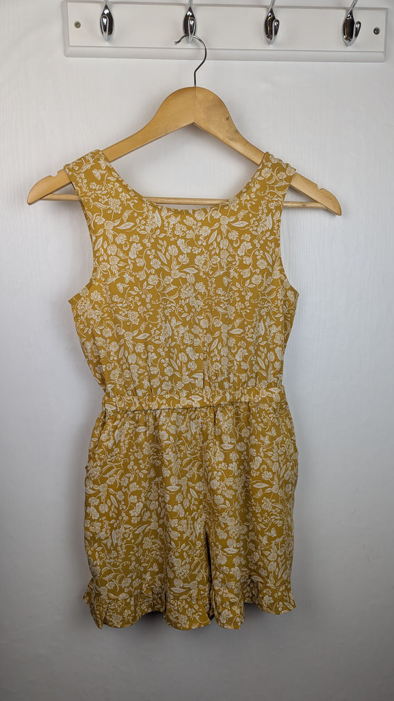 Next Mustard Floral Twist Back Playsuit - Girls 9 Years Little Ones Preloved Used, Preloved, Preworn Baby, Girls & Boys Clothes. Kids & Children's second hand Clothing UK Online. Cheap affordable. Brands including Next, Joules, Nutmeg Morrisons, TU, F&F, H&M.