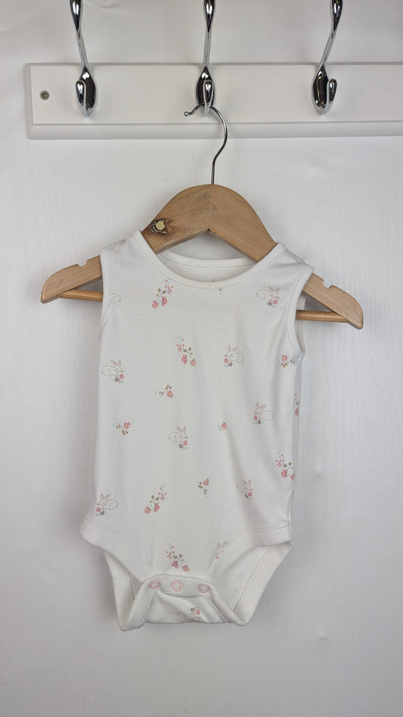 Next Sleeveless White Floral Bunny Bodysuit - Girls 3-6 Months Little Ones Preloved Used, Preloved, Preworn Baby, Girls & Boys Clothes. Kids & Children's second hand Clothing UK Online. Cheap affordable. Brands including Next, Joules, Nutmeg Morrisons, TU, F&F, H&M.