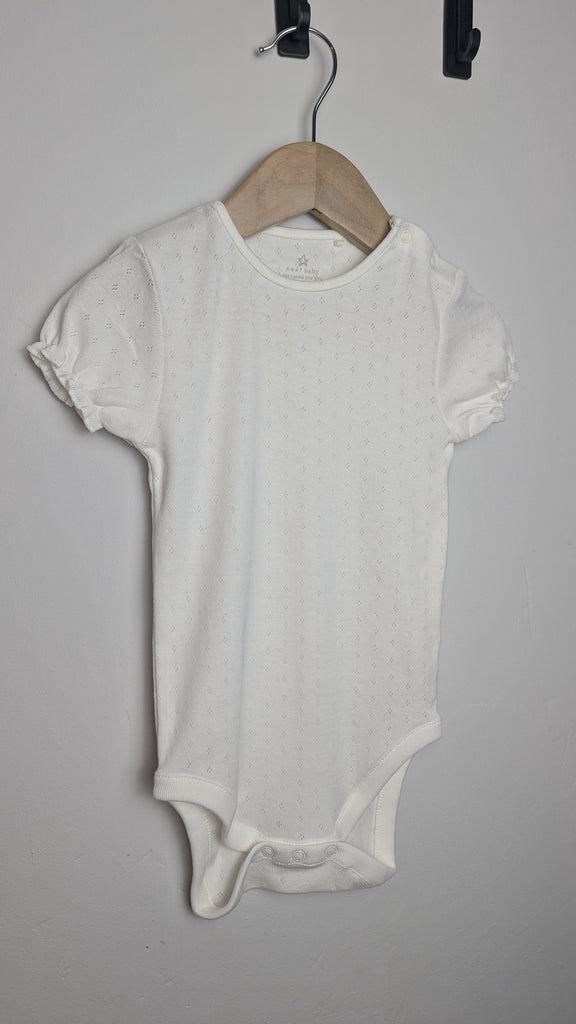 Next White Eyelet Bodysuit - Girls 18-24 months Little Ones Preloved Used, Preloved, Preworn Baby, Girls & Boys Clothes. Kids & Children's second hand Clothing UK Online. Cheap affordable. Brands including Next, Joules, Nutmeg Morrisons, TU, F&F, H&M.