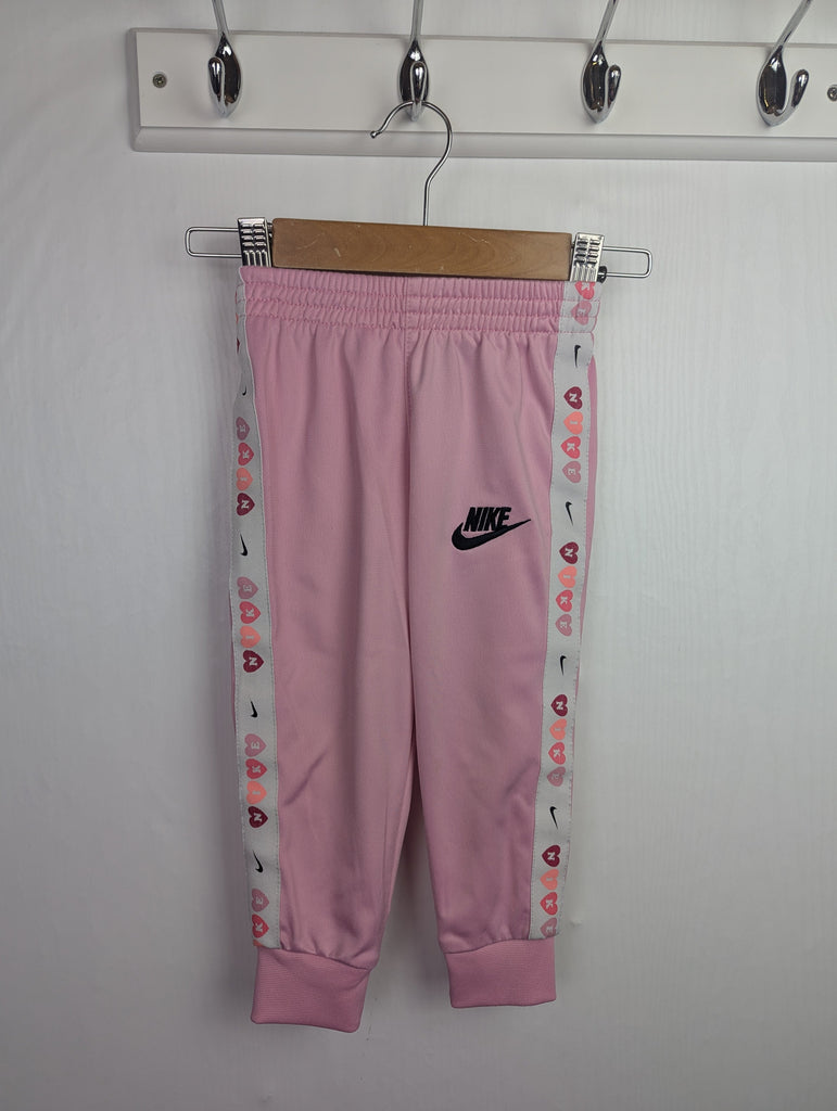 Nike Pink Tracksuit Sport Bottoms - Girls 18 Months Little Ones Preloved Used, Preloved, Preworn Baby, Girls & Boys Clothes. Kids & Children's second hand Clothing UK Online. Cheap affordable. Brands including Next, Joules, Nutmeg Morrisons, TU, F&F, H&M.