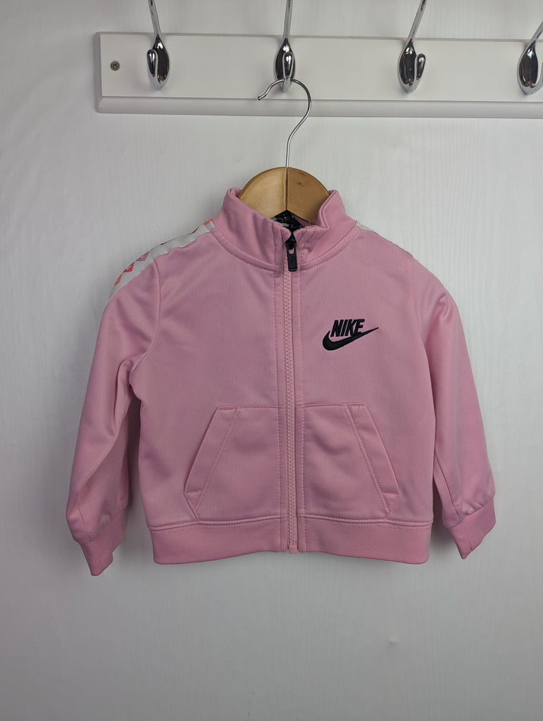 Nike Pink Tracksuit Zip Jumper - Girls 18 Months Little Ones Preloved Used, Preloved, Preworn Baby, Girls & Boys Clothes. Kids & Children's second hand Clothing UK Online. Cheap affordable. Brands including Next, Joules, Nutmeg Morrisons, TU, F&F, H&M.