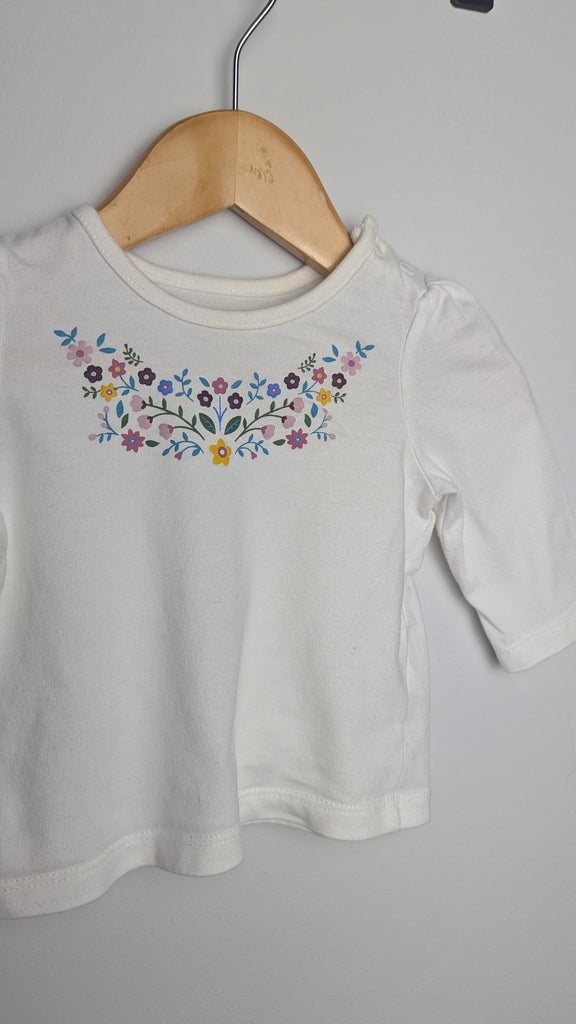 Nutmeg White Floral Top - Girls 0-3 Months Little Ones Preloved Used, Preloved, Preworn & Second Hand Baby, Kids & Children's Clothing UK Online. Cheap affordable. Brands including Next, Joules, Nutmeg Morrisons, TU, F&F, H&M.