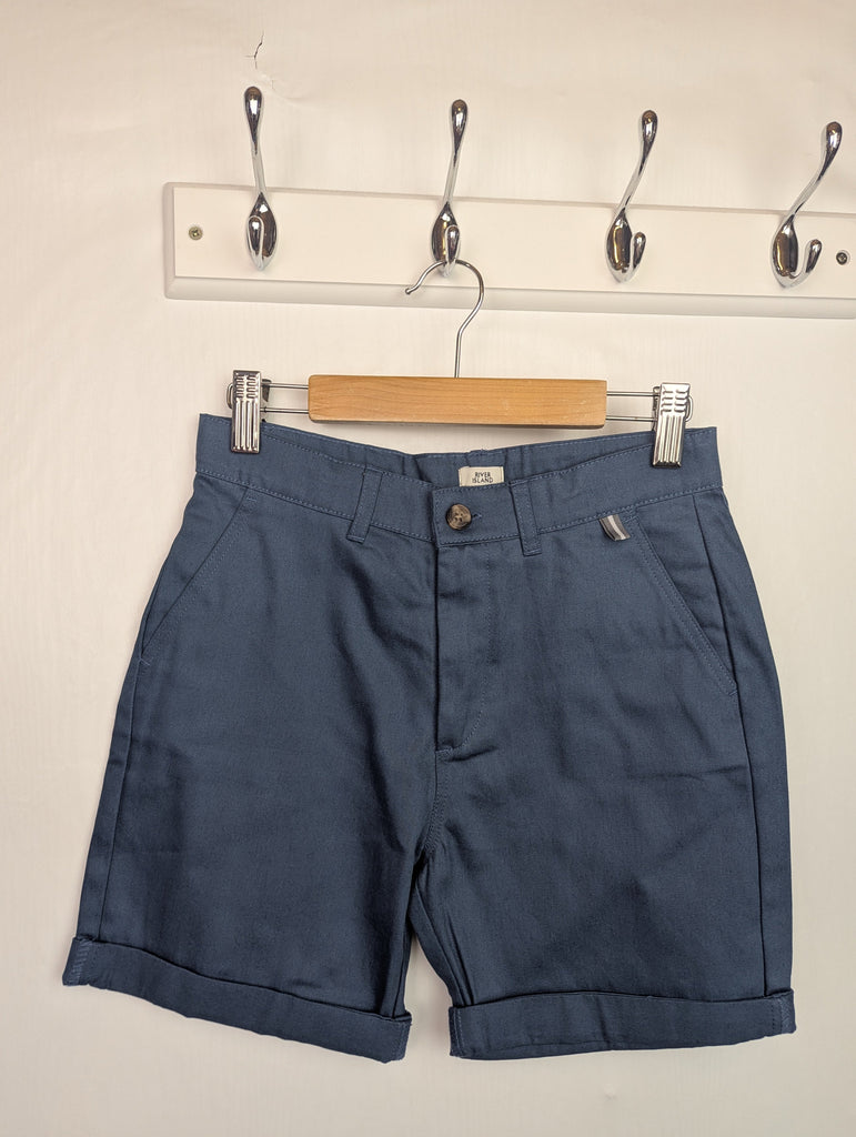 NWOT's River Island Blue Chino Shorts - Boys 9-10 Years Little Ones Preloved Used, Preloved, Preworn Baby, Girls & Boys Clothes. Kids & Children's second hand Clothing UK Online. Cheap affordable. Brands including Next, Joules, Nutmeg Morrisons, TU, F&F, H&M.