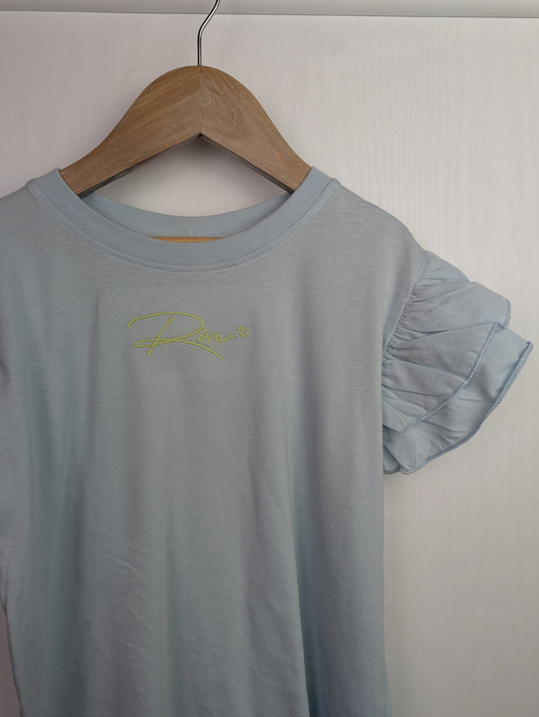 NWOT's River Island Blue Top - Girls 7-8 Years Little Ones Preloved Used, Preloved, Preworn Baby, Girls & Boys Clothes. Kids & Children's second hand Clothing UK Online. Cheap affordable. Brands including Next, Joules, Nutmeg Morrisons, TU, F&F, H&M.