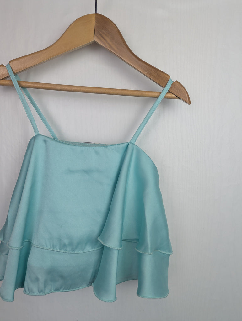 NWOT's River Island Blue/Green Top - Girls 5-6 Years Little Ones Preloved Used, Preloved, Preworn Baby, Girls & Boys Clothes. Kids & Children's second hand Clothing UK Online. Cheap affordable. Brands including Next, Joules, Nutmeg Morrisons, TU, F&F, H&M.