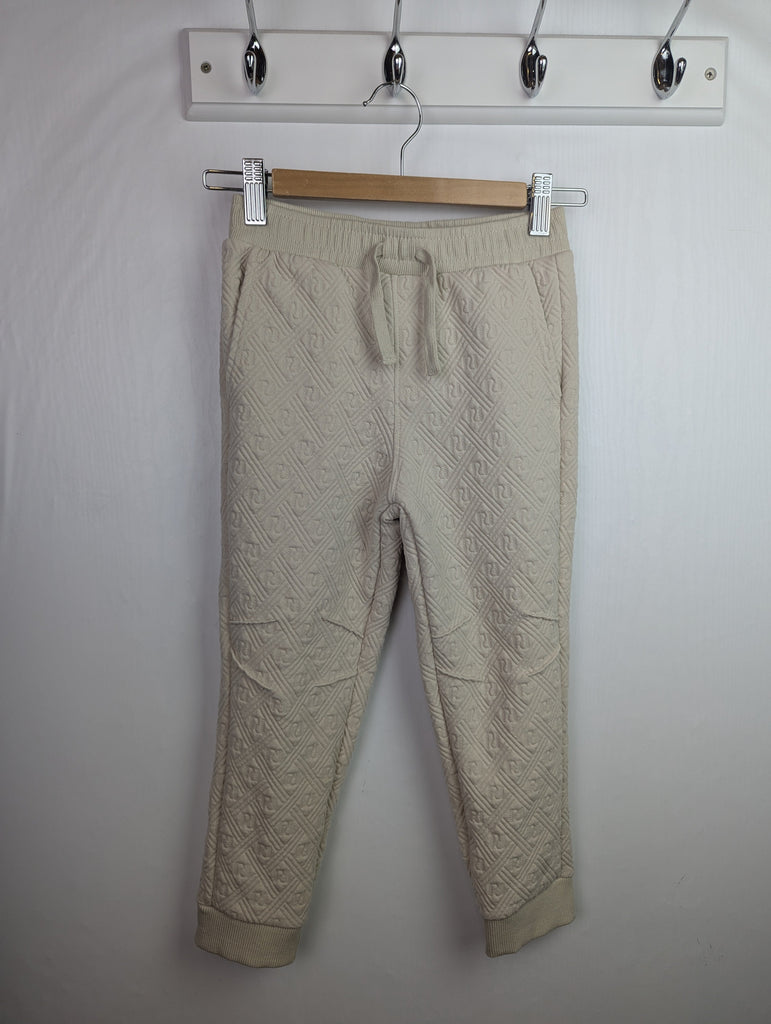 NWOT's River Island Cream Joggers - Boys 4-5 Years Little Ones Preloved Used, Preloved, Preworn Baby, Girls & Boys Clothes. Kids & Children's second hand Clothing UK Online. Cheap affordable. Brands including Next, Joules, Nutmeg Morrisons, TU, F&F, H&M.