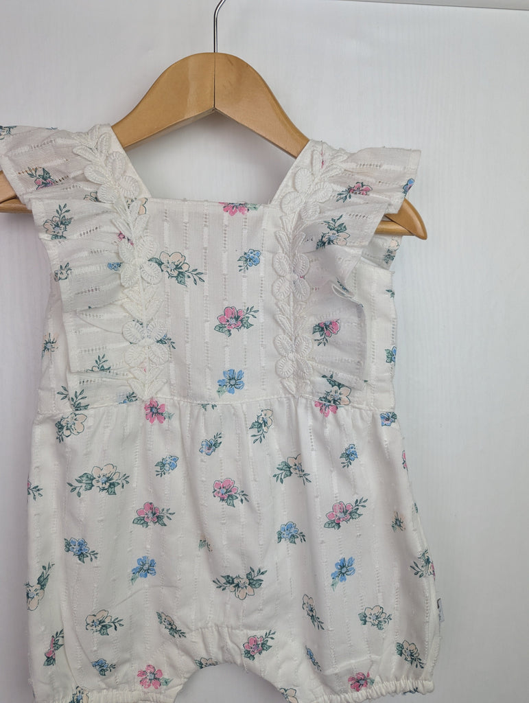 NWOT's River Island Floral Romper - Girls 0-3 Months Little Ones Preloved Used, Preloved, Preworn Baby, Girls & Boys Clothes. Kids & Children's second hand Clothing UK Online. Cheap affordable. Brands including Next, Joules, Nutmeg Morrisons, TU, F&F, H&M.