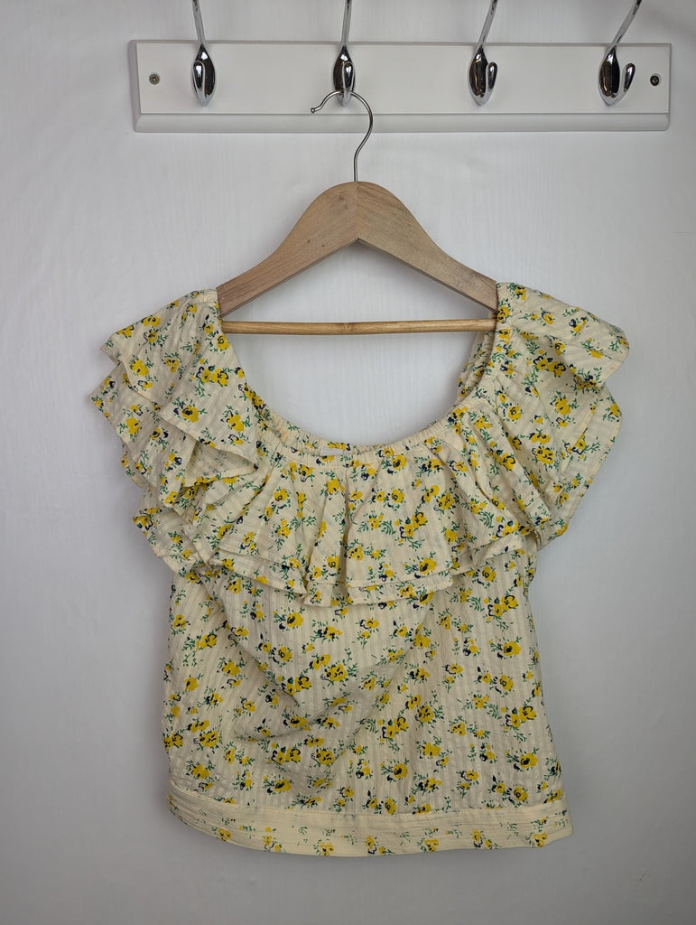 NWOT's River Island Floral Ruffle Top - Girls 13-14 Years Little Ones Preloved Used, Preloved, Preworn Baby, Girls & Boys Clothes. Kids & Children's second hand Clothing UK Online. Cheap affordable. Brands including Next, Joules, Nutmeg Morrisons, TU, F&F, H&M.