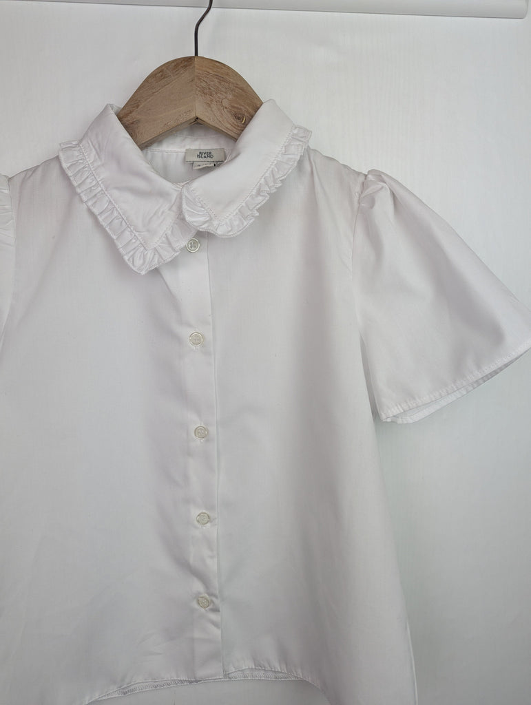 NWOT's River Island Frill Collar Shirt - Girls 7-8 Years Little Ones Preloved Used, Preloved, Preworn Baby, Girls & Boys Clothes. Kids & Children's second hand Clothing UK Online. Cheap affordable. Brands including Next, Joules, Nutmeg Morrisons, TU, F&F, H&M.