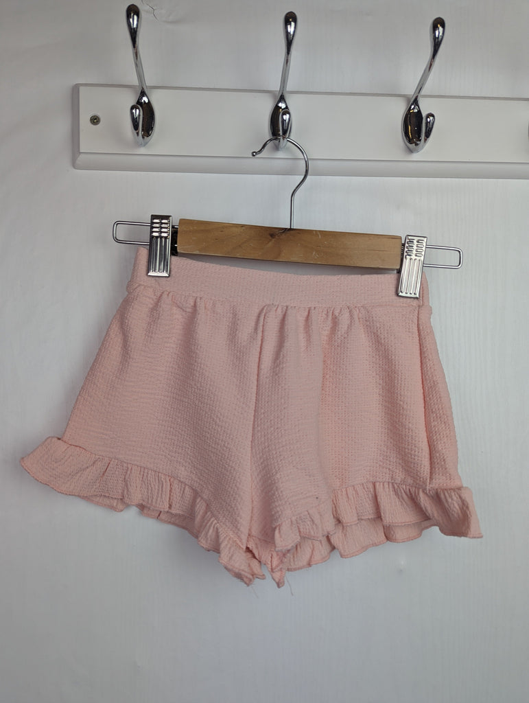 NWOT's River Island Pink Ruffle Shorts - Girls 12-18 Months Little Ones Preloved Used, Preloved, Preworn Baby, Girls & Boys Clothes. Kids & Children's second hand Clothing UK Online. Cheap affordable. Brands including Next, Joules, Nutmeg Morrisons, TU, F&F, H&M.