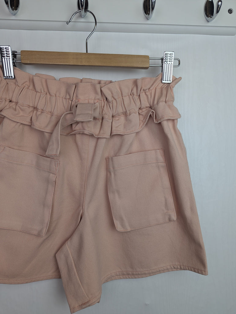NWOT's River Island Pink Shorts - Girls 9-10 Years Little Ones Preloved Used, Preloved, Preworn Baby, Girls & Boys Clothes. Kids & Children's second hand Clothing UK Online. Cheap affordable. Brands including Next, Joules, Nutmeg Morrisons, TU, F&F, H&M.