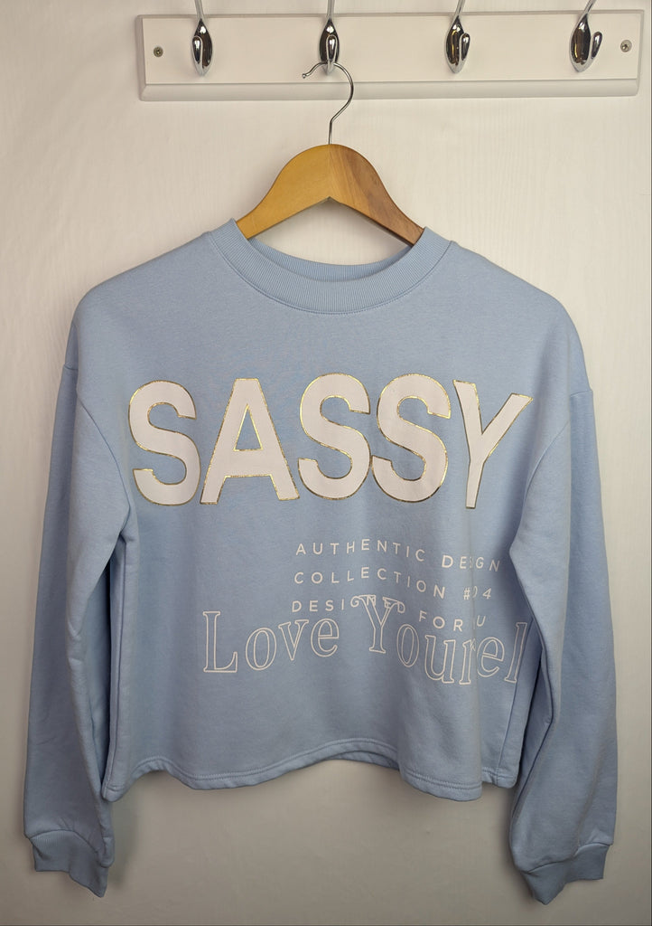 NWOT's River Island 'Sassy' Jumper - Girls 13-14 Years Little Ones Preloved Used, Preloved, Preworn Baby, Girls & Boys Clothes. Kids & Children's second hand Clothing UK Online. Cheap affordable. Brands including Next, Joules, Nutmeg Morrisons, TU, F&F, H&M.