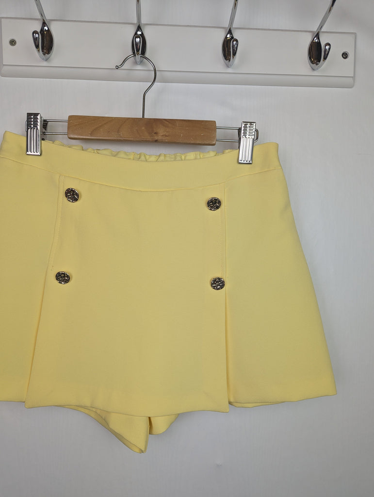 NWOT's River Island Yellow Skort - Girls 11-12 Years Little Ones Preloved Used, Preloved, Preworn Baby, Girls & Boys Clothes. Kids & Children's second hand Clothing UK Online. Cheap affordable. Brands including Next, Joules, Nutmeg Morrisons, TU, F&F, H&M.